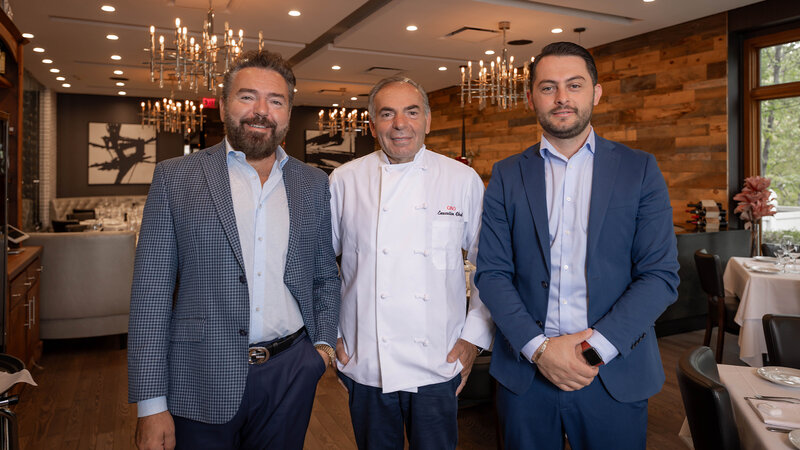 Sear House Grille staff and ownership standing side-by-side